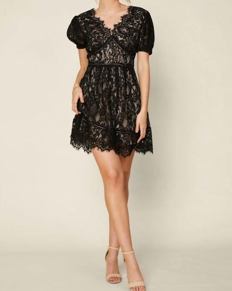 Front of a model wearing a size Large The Alva Short Sleeve Lace Trim Mini Dress In Black in Black by Skies are Blue. | dia_product_style_image_id:345472